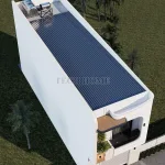 Tổng thể từ trên cao mẫu nhà phố 2 tầng hiện đại với hệ mái tôn chống nóng và bồn nước thái dương năng.