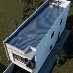 Tổng thể mẫu nhà ống 2 tầng 4 phòng ngủ sử dụng mái tôn chống nóng và hệ thống thái dương năng.