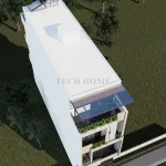Tổng thể mẫu nhà phố 3 tầng hiện đại nhìn từ trên cao với tầng tum và sân chơi rộng.